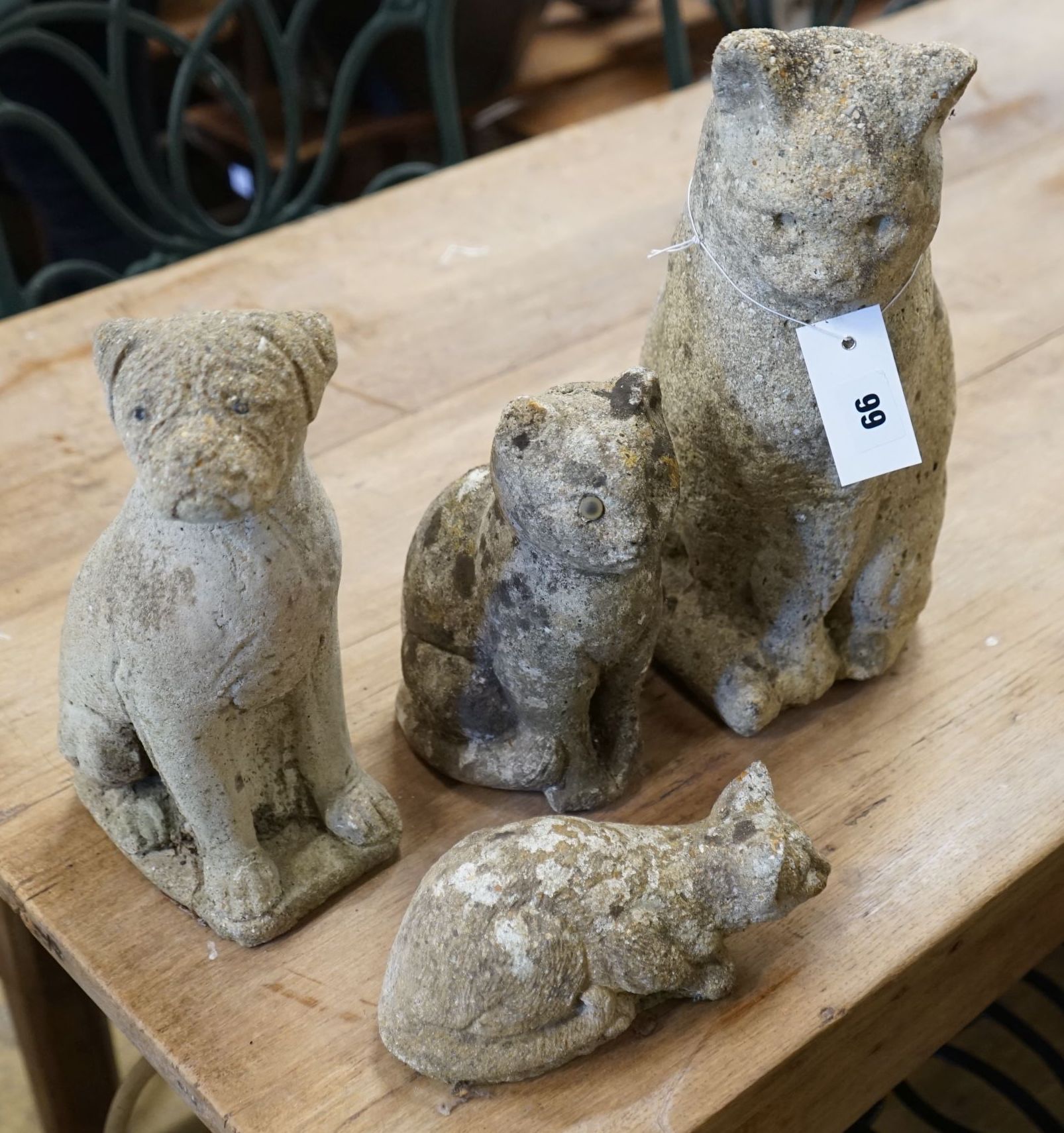 Four reconstituted stone cat and puppy garden ornaments, largest height 33cm